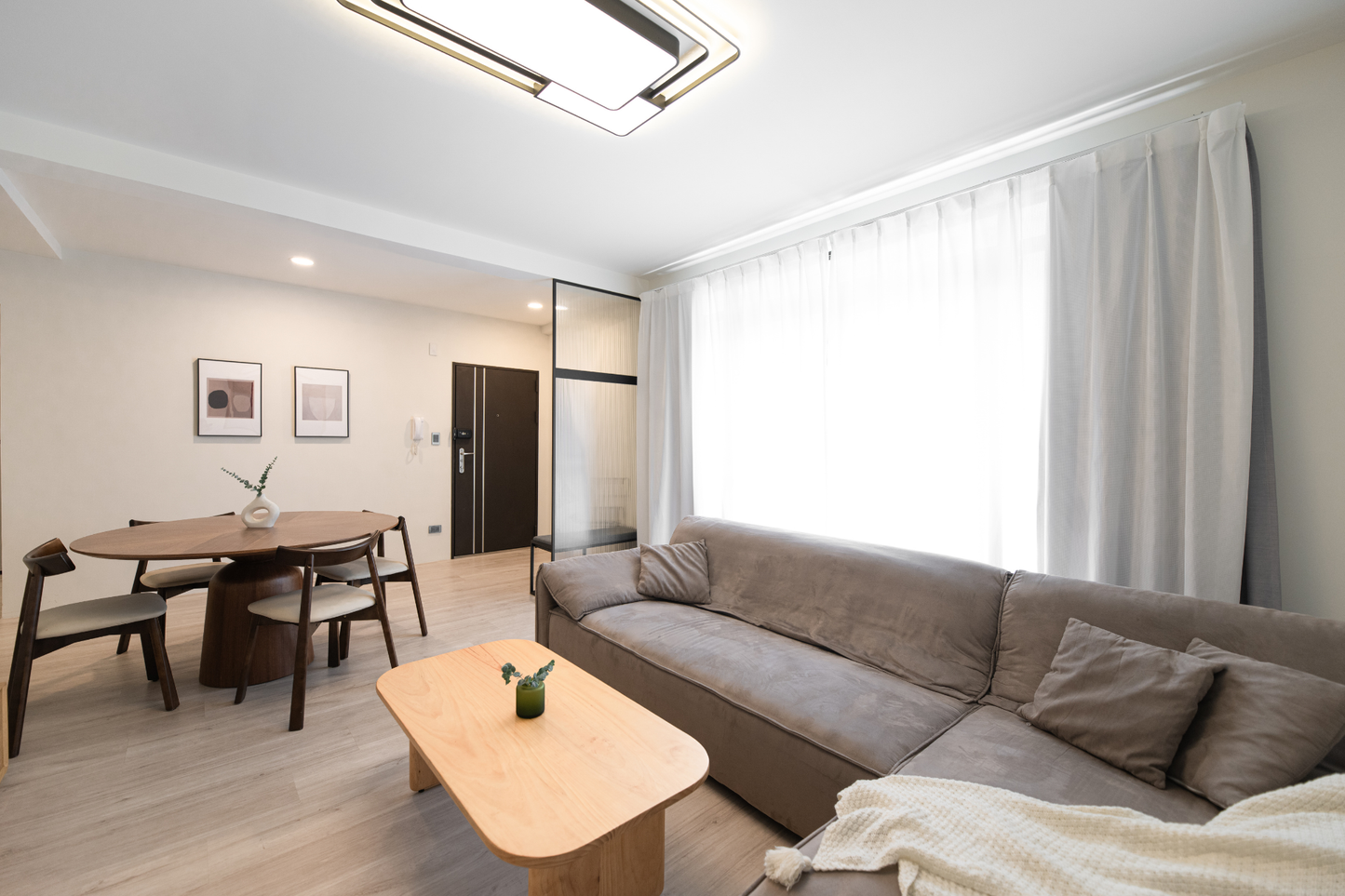 Modern living room in Taipei Taiwan short-term apartment with minimalist design - Kolette Home