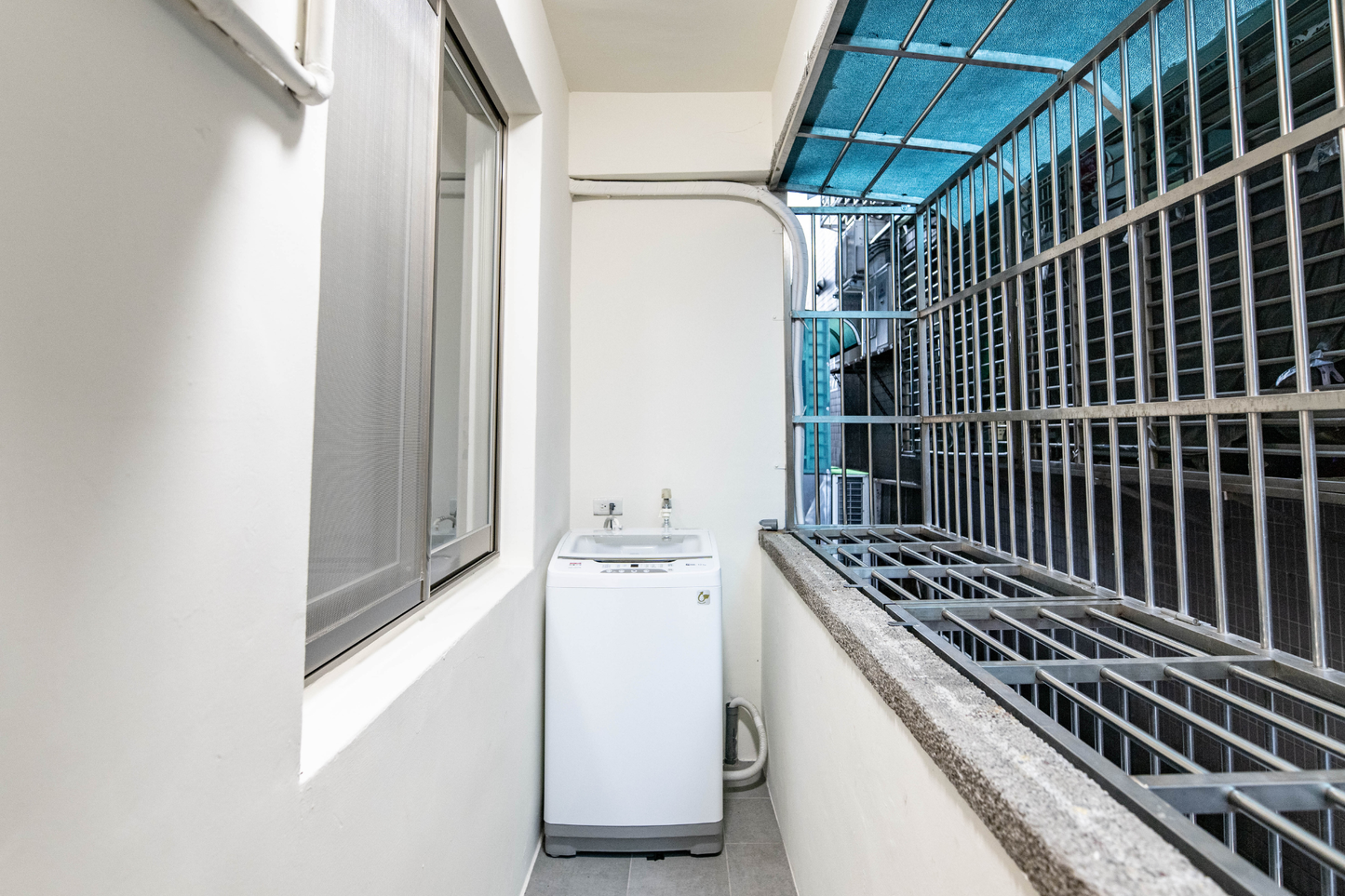 In-unit laundry with washer and dryer in Taipei Taiwan short-term apartment for convenience - Kolette Home