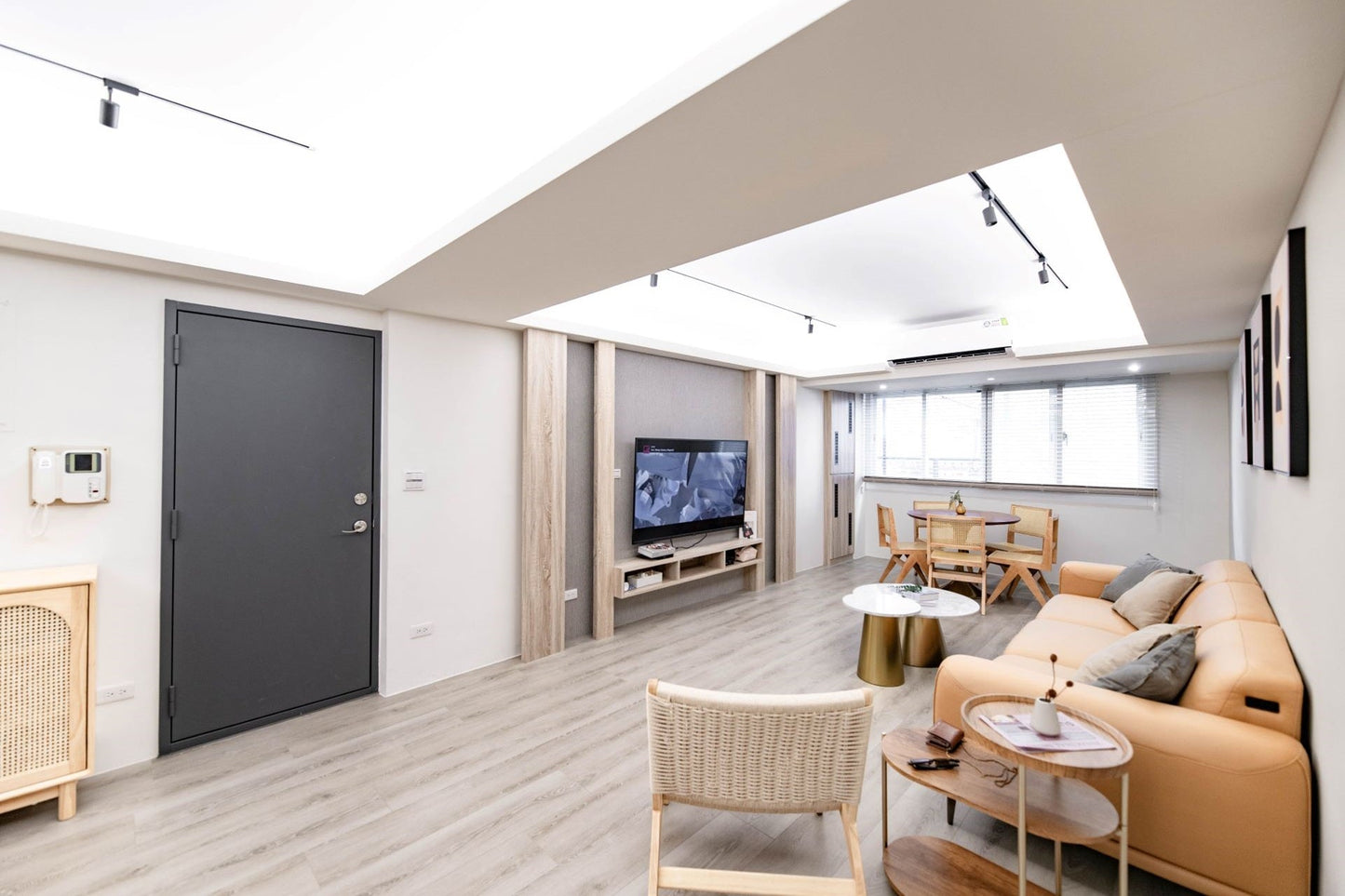 Modern living room in Taipei Taiwan short-term apartment with minimalist design - Kolette Home