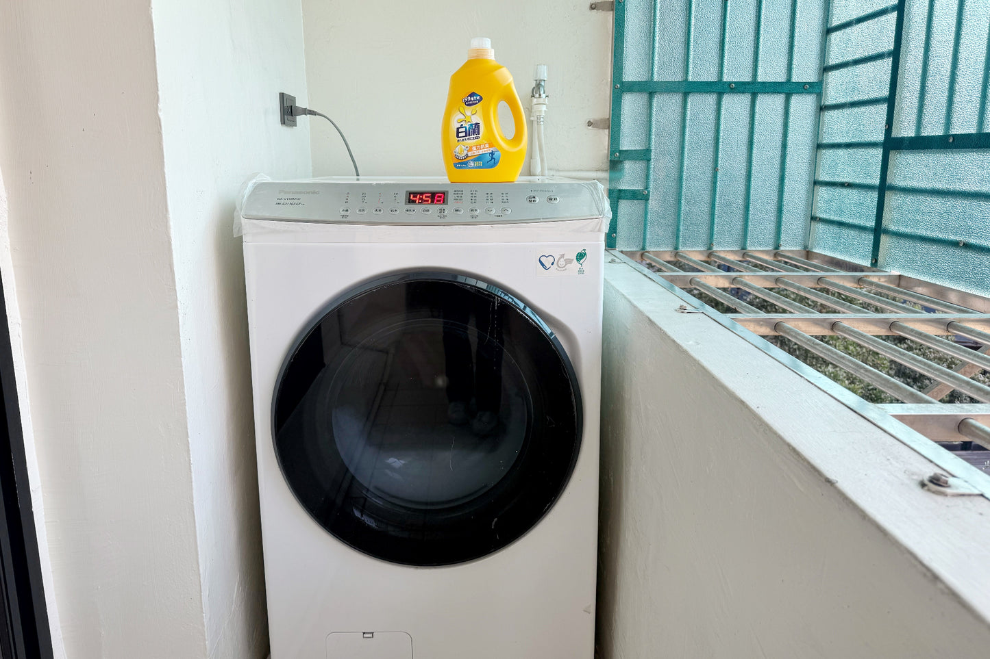 In-unit laundry with washer and dryer in Taipei Taiwan short-term apartment for convenience - Kolette Home