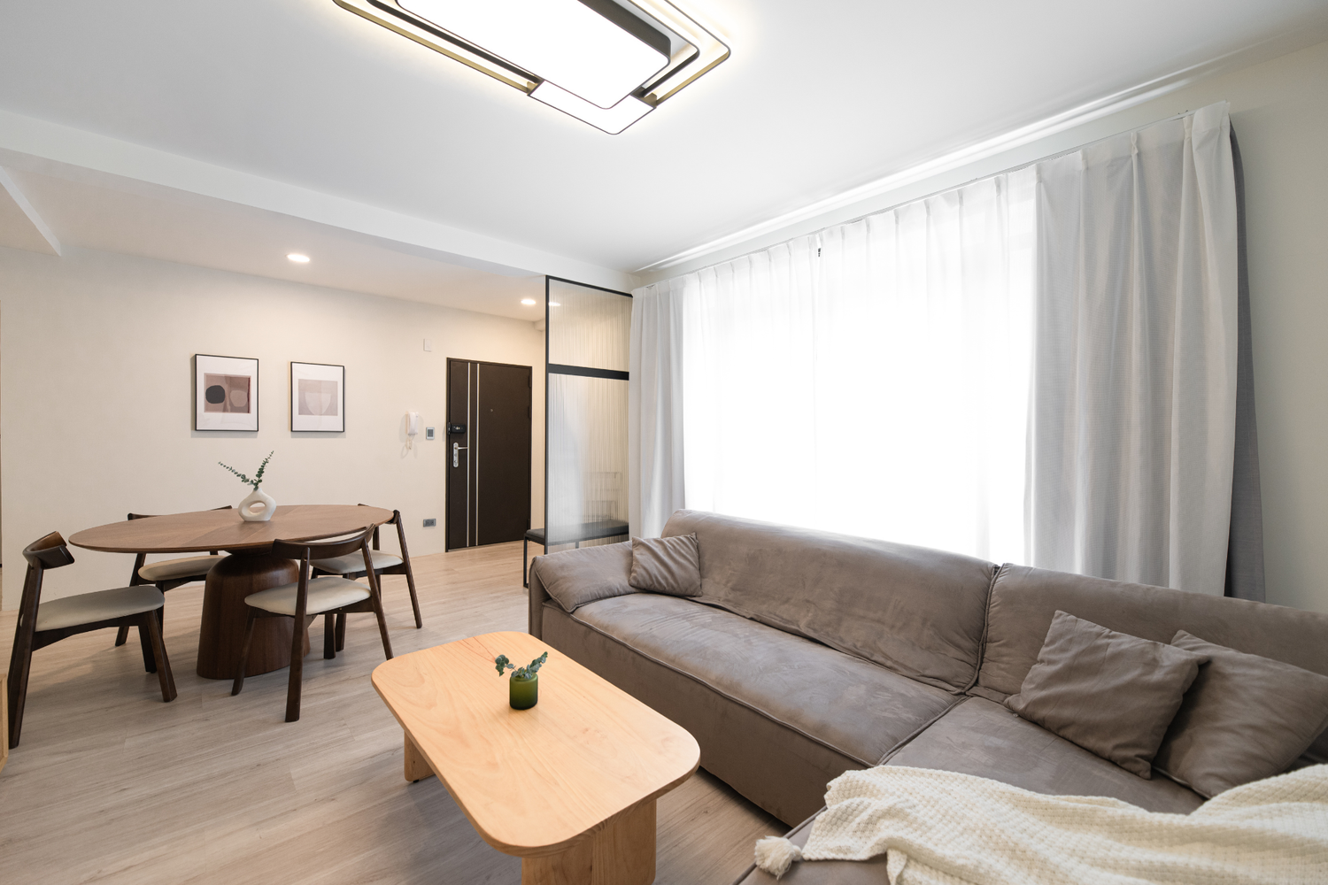 Modern living room in Taipei Taiwan short-term apartment with minimalist design - Kolette Home