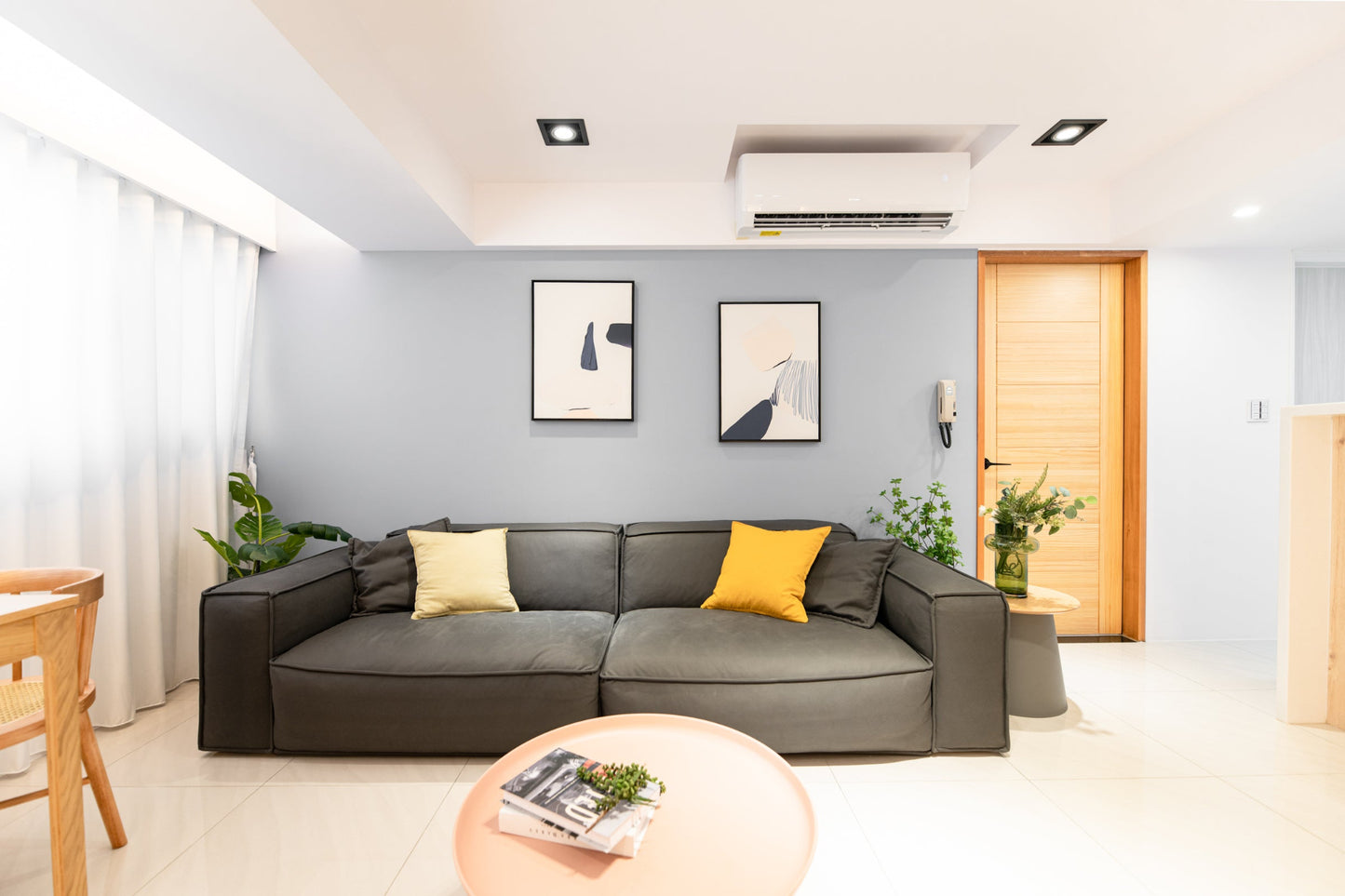 Modern living room in Taipei Taiwan short-term apartment with minimalist design - Kolette Home
