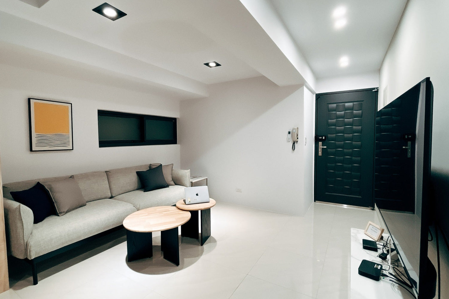 Modern living room in Taipei Taiwan short-term apartment with minimalist design - Kolette Home