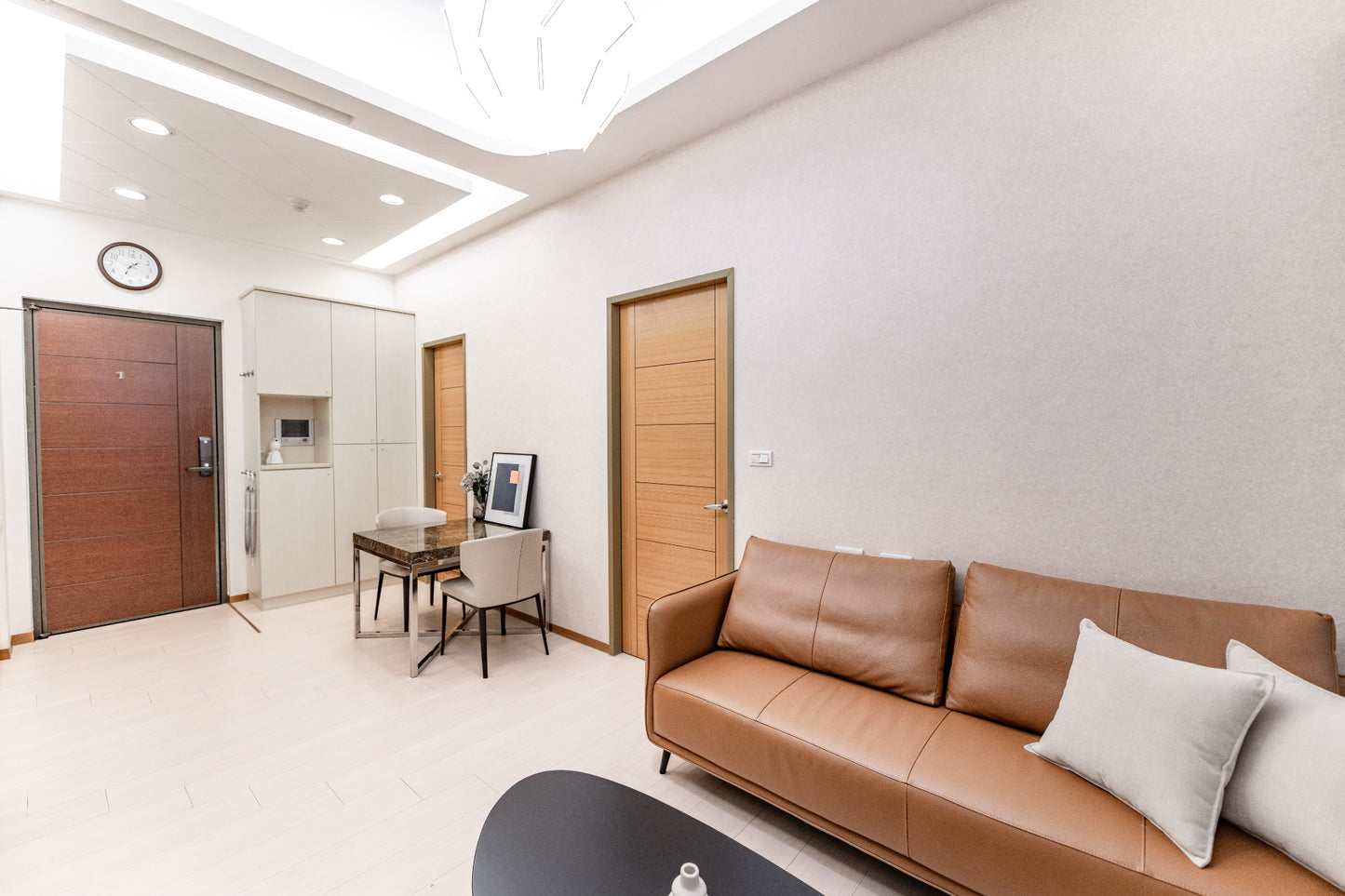 Kolette Home living room with natural light, minimalist furniture and smart TV for long-term stay in Taipei.