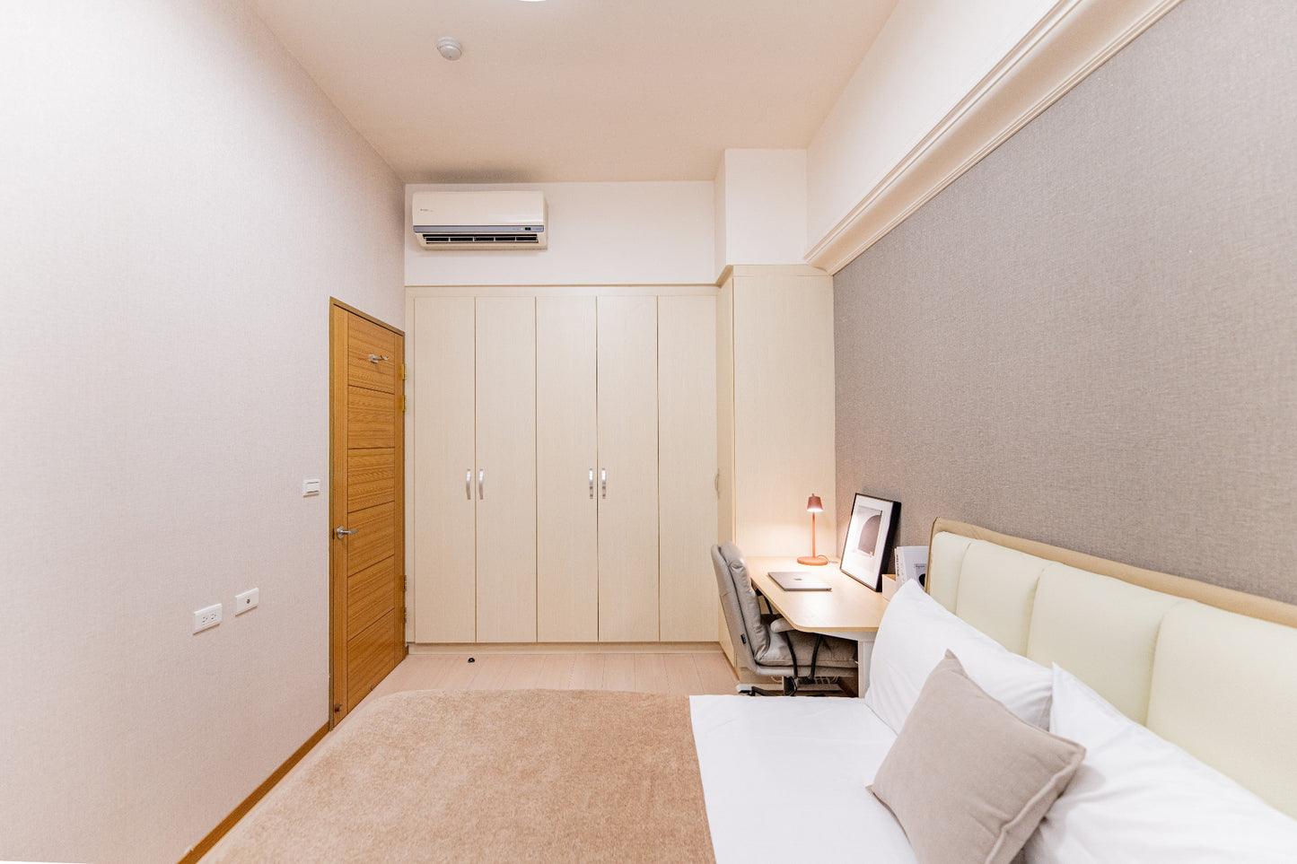 Quiet Kolette Home bedroom with premium bedding and blackout curtains for a restful night in the city.