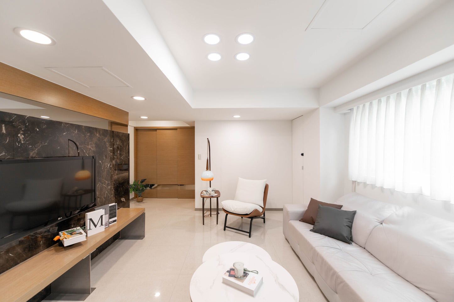 Modern living room in Taipei Taiwan short-term apartment with minimalist design - Kolette Home