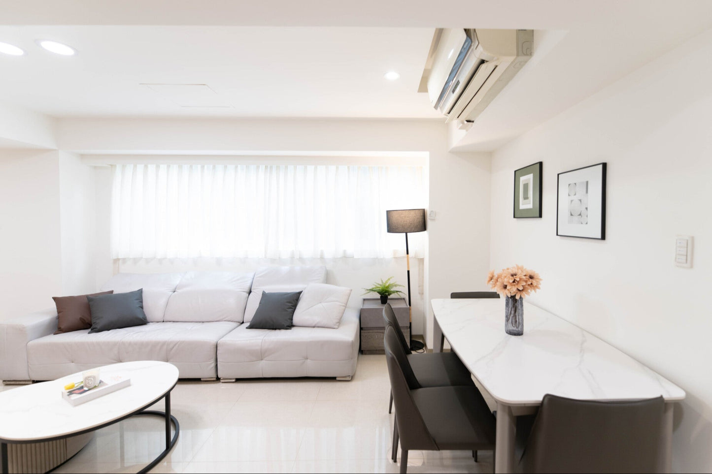 Modern living room in Taipei Taiwan short-term apartment with minimalist design - Kolette Home