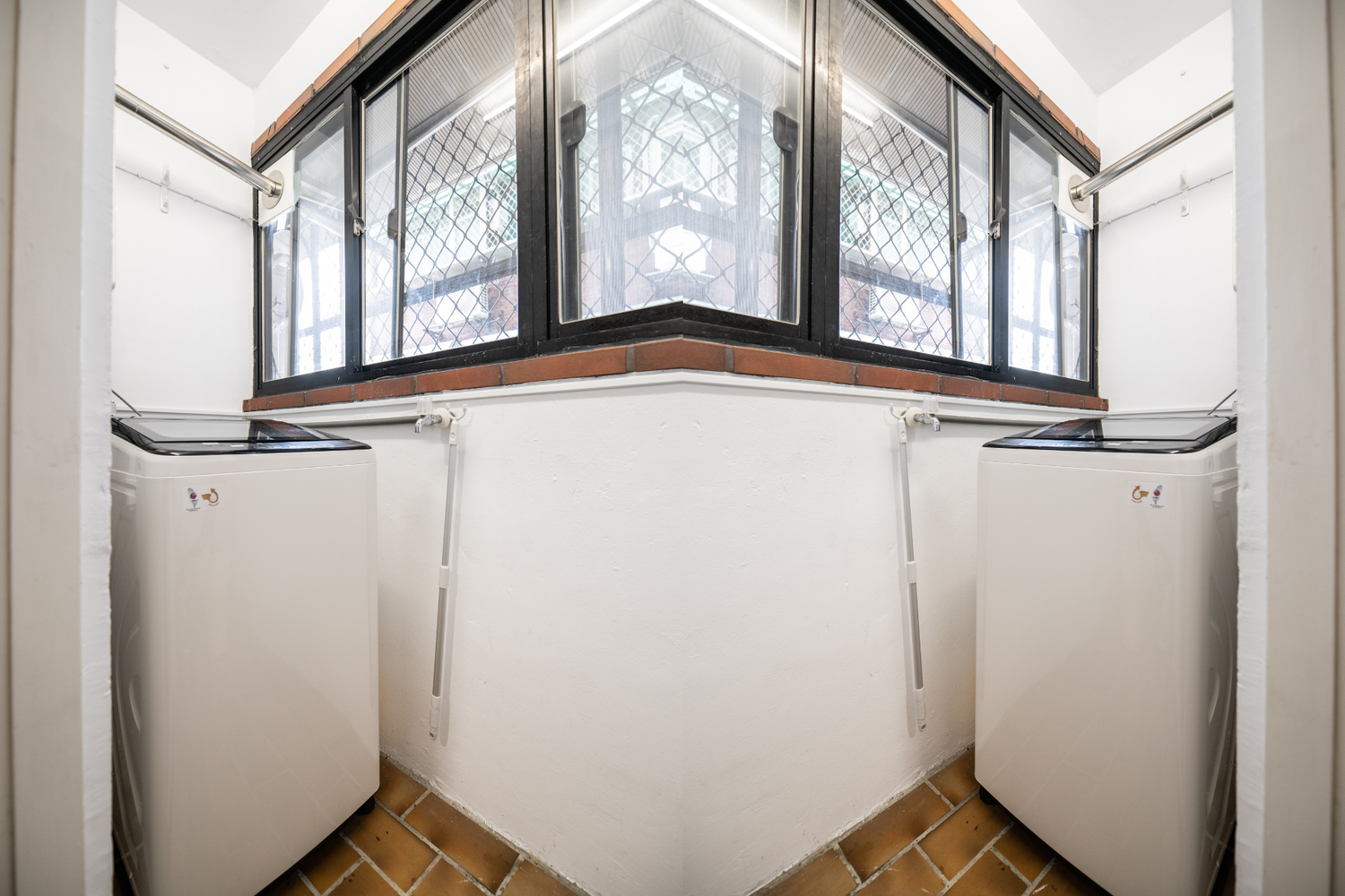 In-unit laundry with washer in Taipei Taiwan short-term apartment for convenience - Kolette Hom