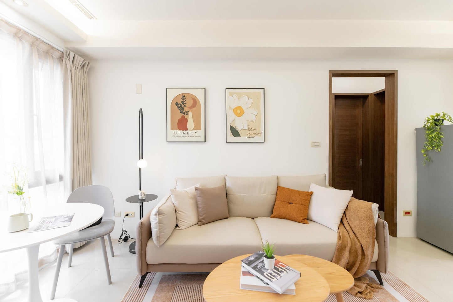 Modern living room in Taipei Taiwan short-term apartment with minimalist design - Kolette Home