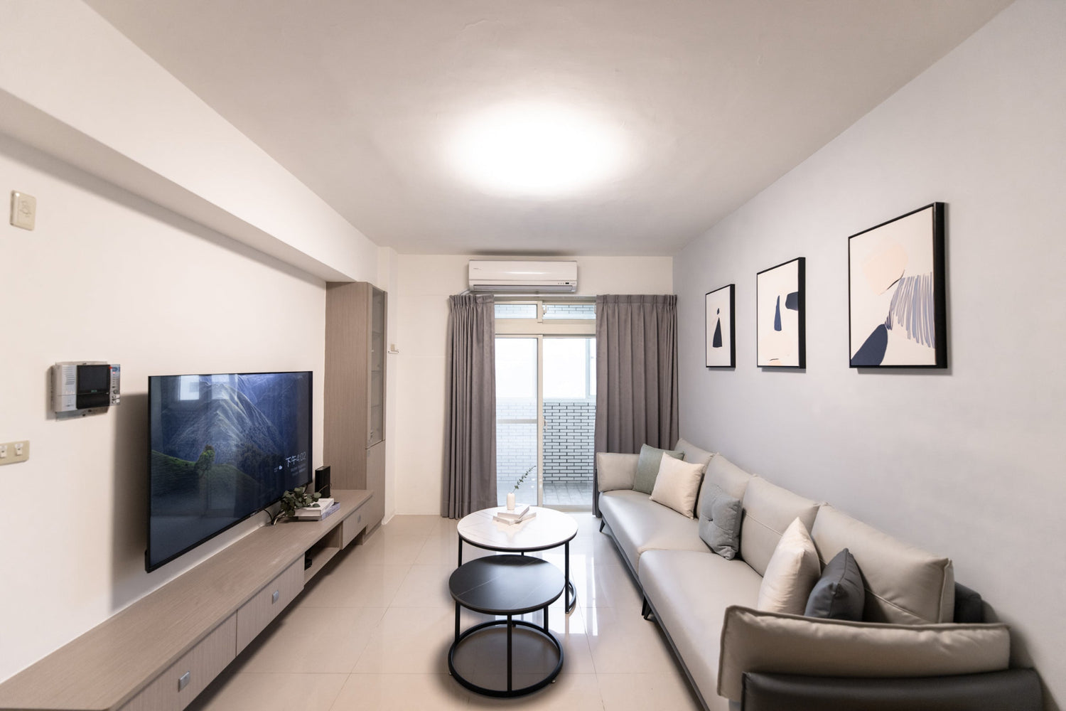 Modern living room in Taipei Taiwan short-term apartment with minimalist design - Kolette Home