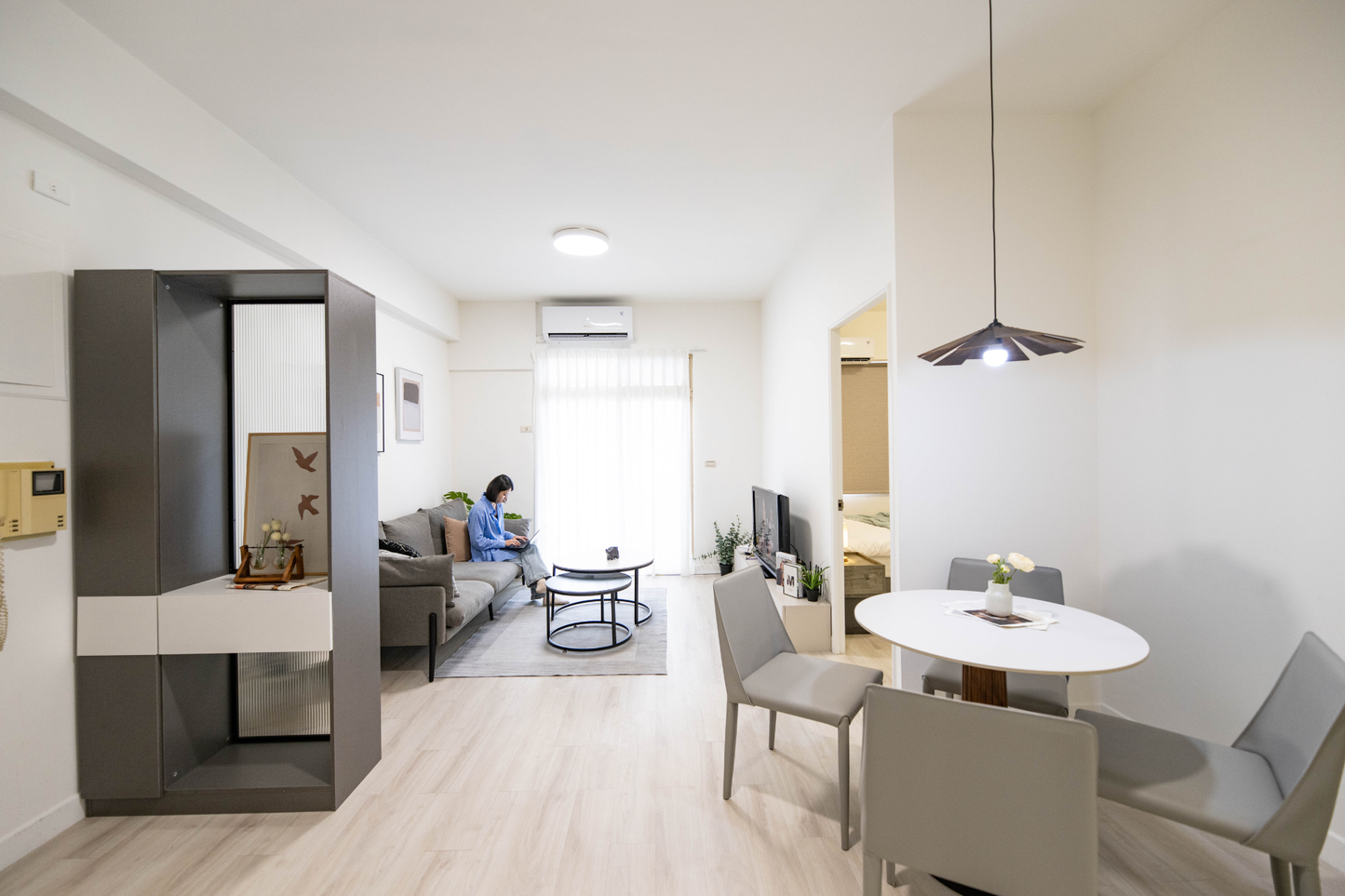 Modern living room in Taipei Taiwan short-term apartment with minimalist design - Kolette Home
