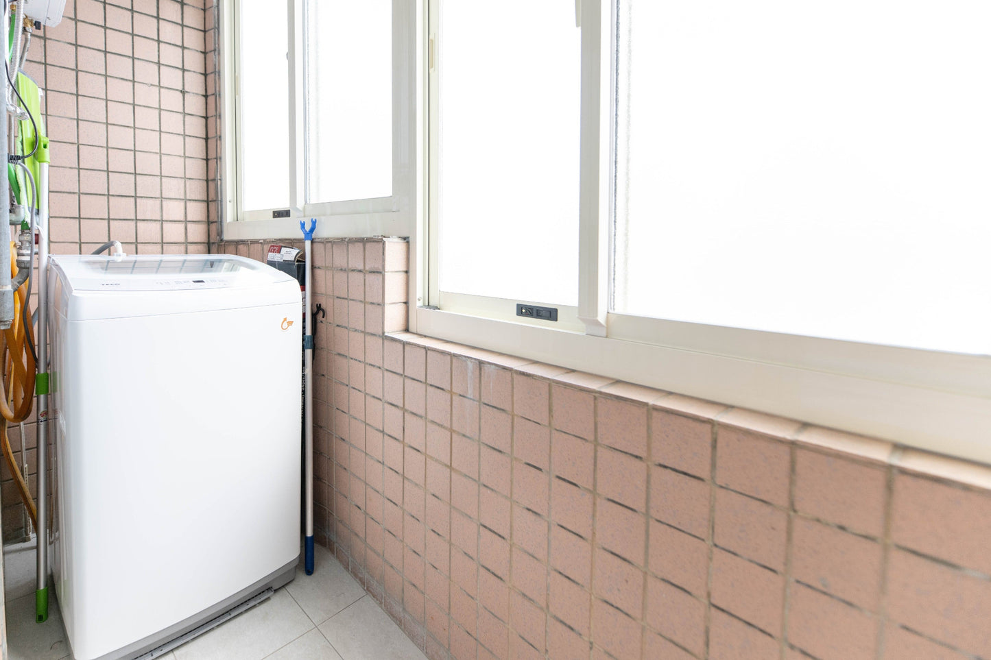 In-unit laundry with washer and dryer in Taipei Taiwan short-term apartment for convenience - Kolette Home