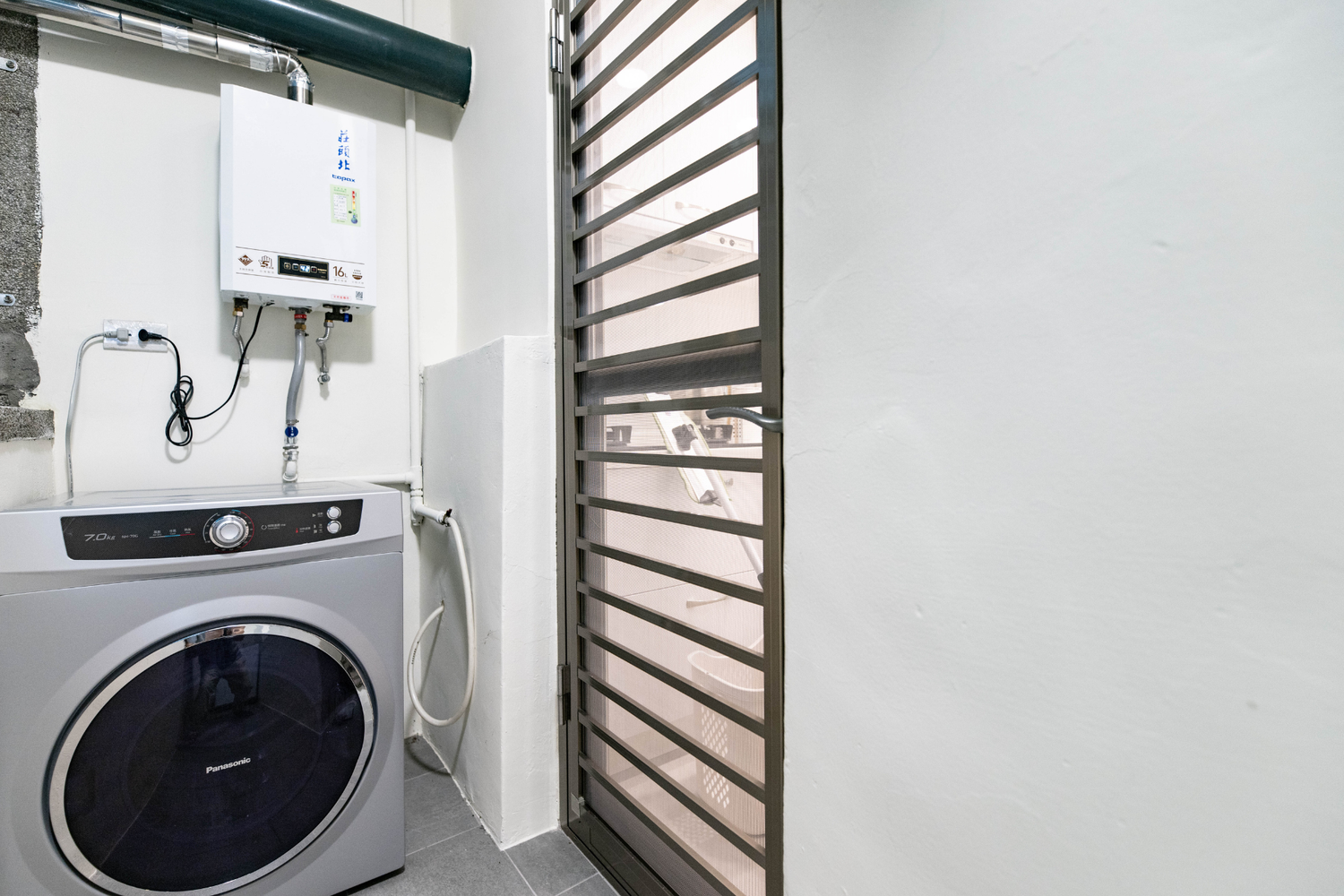 In-unit laundry with washer and dryer in Taipei Taiwan short-term apartment for convenience - Kolette Home