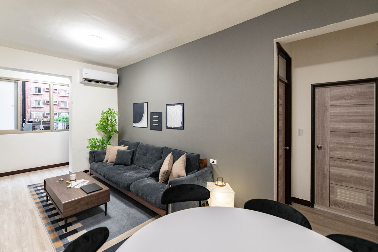 Modern living room in Taipei Taiwan short-term apartment with minimalist design - Kolette Home
