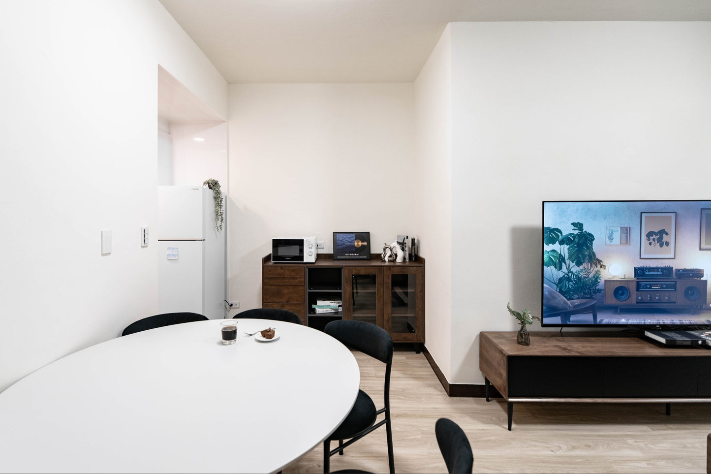 Modern living room in Taipei Taiwan short-term apartment with minimalist design - Kolette Home