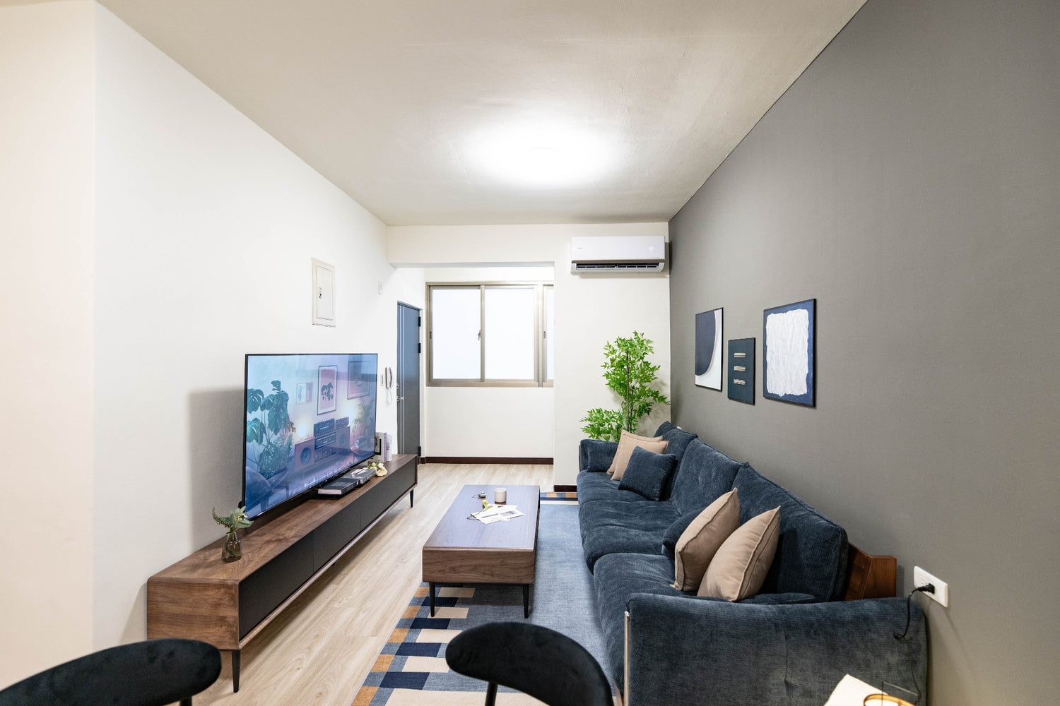 Modern living room in Taipei Taiwan short-term apartment with minimalist design - Kolette Home