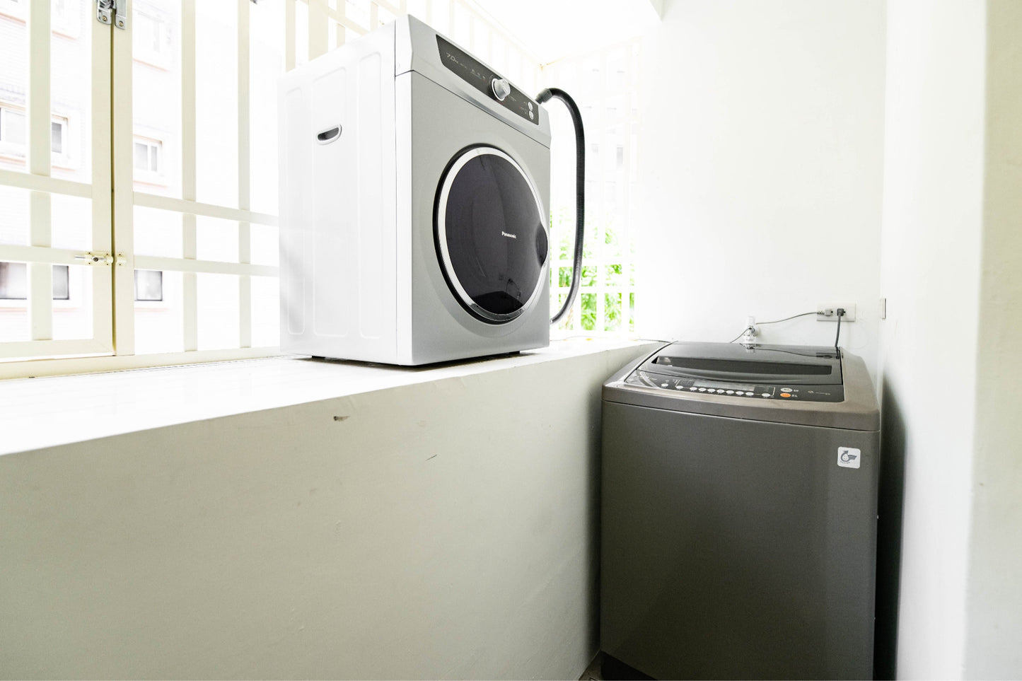 In-unit laundry with washer and dryer in Taipei Taiwan short-term apartment for convenience - Kolette Home