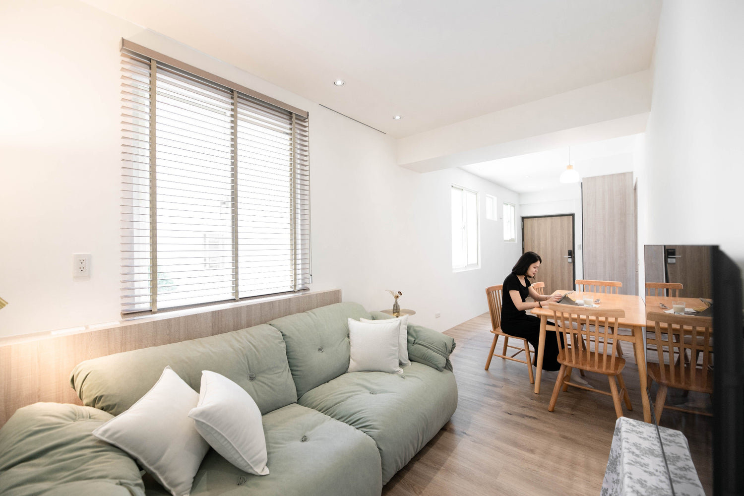 Modern living room in Taipei Taiwan short-term apartment with minimalist design - Kolette Home