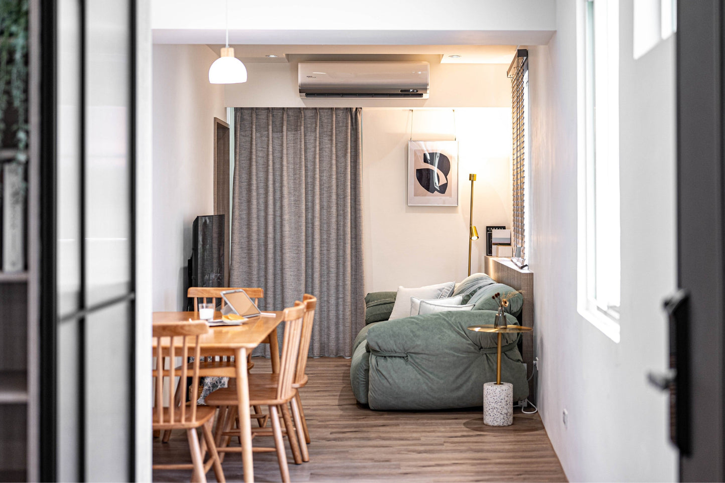 Modern living room in Taipei Taiwan short-term apartment with minimalist design - Kolette Home