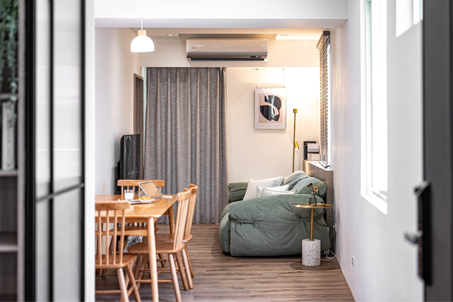 Modern living room in Taipei Taiwan short-term apartment with minimalist design - Kolette Home